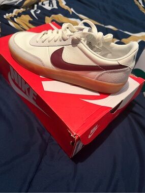 Nike White Low-Top Sneakers with Burgundy Swoosh and Gum Sole